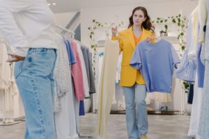 Woman shopping in a store with stylist