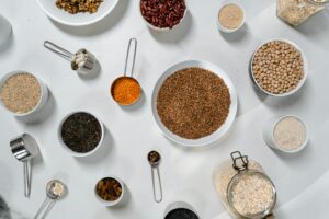  Bowls filled with different types of grains and beans, highlighting their diverse shapes and hues